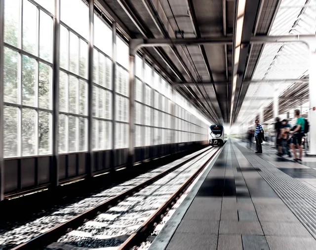 passengers, people, railway, station, terminal, train, train station, gray train. Booking a Train Trip: Questions for a Rail Weekend