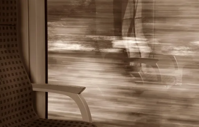 train, travel, seat, window, mirrors, landscape, relax, ice, mirror image, look out, lawn, to sit, rails, rail, railroad, transport, drive train, seating, rest break, reflection, watch, sepia. Does a regional rail day bag need more than power, food, and layers?